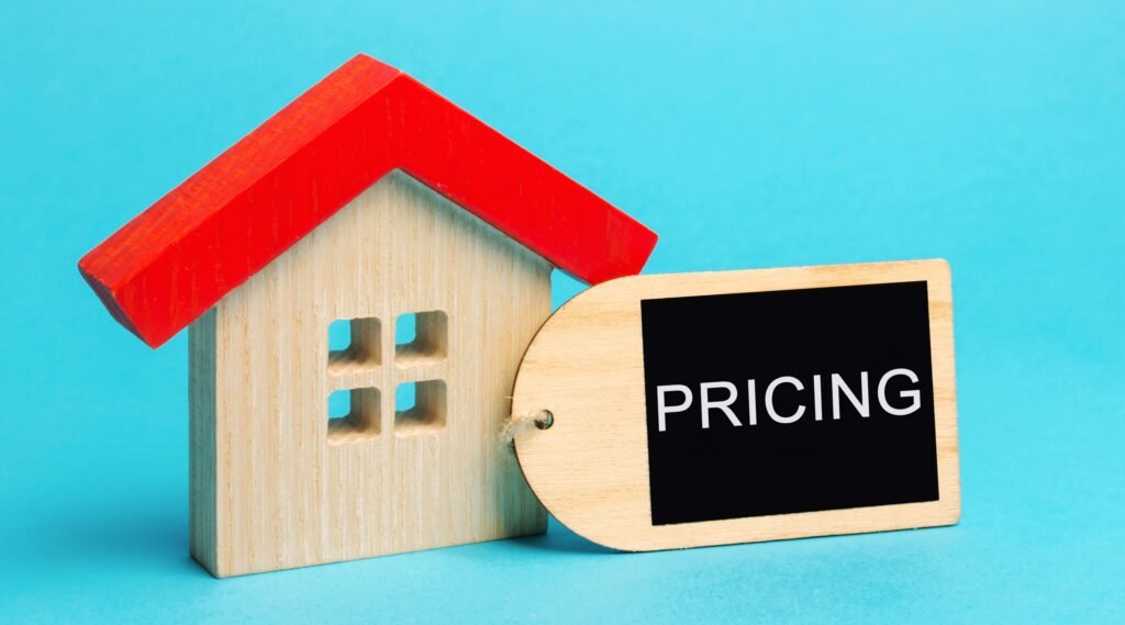 Wooden house with the words Pricing The cost of housing in the primary and secondary market Demand for real estate Apartments and houses - Home Builder Marketers