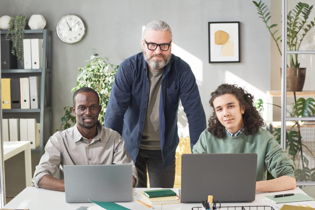Teacher with students at office - Home Builder Marketers